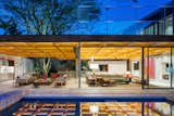 Living / Dining Room and Gourmet Balcony. Photo: Nelson Kon.  Photo 3 of 9 in The Flamboyant House by Perkins&Will Brasil