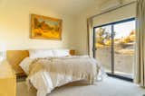 Bedroom, Ceiling Lighting, Bed, and Concrete Floor  Photos from White Desert House: Luxe Hideaway With Views