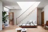 A skylight brings light down through the enlarged stair opening. The door is original and was hand stripped by the owner. Wood floors are form Vermont Plank Flooring and were finished on-site. Daybed was built by the owner. 