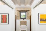 Bath Room, Concrete Wall, Concrete Counter, Ceiling Lighting, Stone Counter, Vessel Sink, One Piece Toilet, Ceramic Tile Floor, Undermount Tub, and Stone Slab Wall  Photos from Casa de Mareas