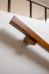 A real wood handrail carefully designed to eliminate any risk of harsh or unsafe contact.