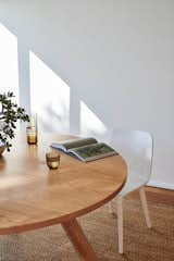 Dining Room, Chair, Medium Hardwood Floor, and Table  Photo 1 of 23 in Portsea Residence by Construct Melbourne