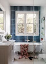 Main Bathroom features vibrant blue tiling to emphasise the layered dialogue between contemporary and traditional elements.