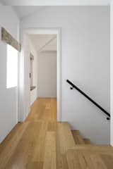 New wide-paneled hardwood floors are used in the hallways and private spaces.