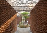 A Brick-and-Concrete Home With a Library Emphasizes Circular Motifs in Mexico - Photo 4 of 13 - 