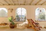 Set 30 minutes south of Joshua Tree National Park, the whitewashed adobe structure features a post-and-beam design with an open-plan living area and shaded outdoor gathering spaces.