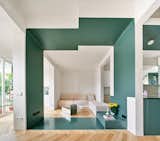 A 1920s Barcelona Flat Trades Confining Walls for a Green-Painted Partition