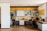 Office, Desk, Cork Floor, Chair, Shelves, Lamps, and Study Room Type Original cork paneling and tile flooring infuse the built-in desk area with retro flair.  Photo 5 of 15 in An Architect’s Midcentury Home With Beaming Interiors Asks $1.7M in L.A. from The Takahashi Residence