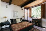 The two bedrooms are spacious and bright, featuring large windows that overlook the tree-tops.  Photo 16 of 31 in The Takahashi Residence by Colby Brown