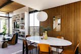 Wood-clad walls continue into the dining area, located just off the living room. The seamless merge between the two spaces caters to smooth entertaining.  Photo 7 of 15 in An Architect’s Midcentury Home With Beaming Interiors Asks $1.7M in L.A. from The Takahashi Residence