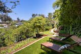 The landscaped lot presents several places to lounge, in addition to a thriving garden. Mature fruit trees also dot the backyard.  Photo 15 of 15 in An Architect’s Midcentury Home With Beaming Interiors Asks $1.7M in L.A. from The Takahashi Residence
