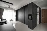 The kitchen is designed as a multifunctional graphite box
