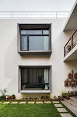 Pop out box windows with geometrically proportioned windows overlooking the garden.