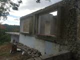 BEFORE From the brick patio, facing the other way, the two large windows, pool and rubble left behind.