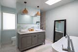 Bath Room, Engineered Quartz Counter, Recessed Lighting, One Piece Toilet, Ceramic Tile Floor, Porcelain Tile Wall, Pendant Lighting, Open Shower, Corner Shower, and Vessel Sink Master Bath  Photo 13 of 17 in Lakeview Residence by Wang Architects