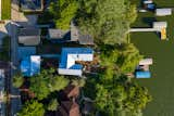 Exterior, Beach House Building Type, House Building Type, Metal Roof Material, Boathouse Building Type, Gable RoofLine, and Wood Siding Material Top View  Photo 2 of 17 in Lakeview Residence by Wang Architects