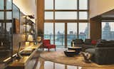The intimacy between the two spaces was emphasized, providing a relaxing moment for families both in the parlor and dining area.   Photo 9 of 35 in Huangpu Riverside Luxurious Penthouse in Shanghai by KWSD
