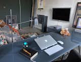 Office, Study Room Type, Desk, and Rug Floor Glass pane served as over two and a half meters table top, thus satisfying the needs of the investor who, while working, prefers the coolness provided by the glass surface.  Photo 8 of 10 in JED Concrete Refuge by Jolanta Dymowicz
