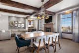 Dining Room, Chair, Pendant Lighting, Ceiling Lighting, Carpet Floor, Standard Layout Fireplace, and Gas Burning Fireplace Living and Dining  Photo 1 of 10 in For $1.95M this Rare Park City Ski-In Ski-Out Condo Can be Yours by Mountain Luxury