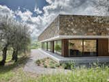 Exterior, House Building Type, Wood Siding Material, Stone Siding Material, Concrete Siding Material, Flat RoofLine, and Glass Siding Material Detail of the West  facade  Photo 8 of 26 in HV Pavillon. A patio house at the foot of mount Amiata, Tuscany, Italy. by Nicola Gibertini