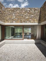 Exterior, Concrete Siding Material, House Building Type, Wood Siding Material, Flat RoofLine, and Stone Siding Material Internal patio  Photo 9 of 26 in HV Pavillon. A patio house at the foot of mount Amiata, Tuscany, Italy. by Nicola Gibertini