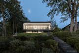Exterior, Flat RoofLine, Glass Siding Material, and House Building Type Lake side at night  Photo 3 of 8 in Kim residence by Agence Spatiale