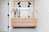 Luxurious double sink with terrazzo flooring and floating vanity