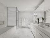 Marble clads the master bathroom for a spa-like appeal.