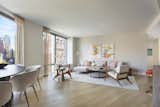 The living room is an open-concept space, tied together by the clever use of an area rug. 