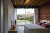Bedroom, Table, Ceiling, and Bed Terra House | Bernardes Arquitetura  Bedroom Table Ceiling Bed Photos from Terra House