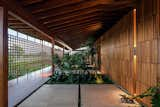 Living Room, Wall Lighting, and Travertine Floor JCA House | Bernardes Arquitetura  Photo 5 of 10 in JCA House by Bernardes Arquitetura