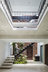 Staircase and Metal Railing  Photo 14 of 23 in A Biophilic Home in Vietnam Impresses With a Hollow-Brick “Breathing Wall”