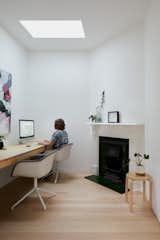 The fireplace in this small office adds a bit of character to an otherwise plain space.&nbsp;