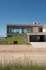 A Concrete Home on the Coast of Argentina Uses Stone to Connect Land and Sea - Photo 1 of 22 - 