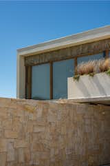 A Concrete Home on the Coast of Argentina Uses Stone to Connect Land and Sea - Photo 2 of 22 - 
