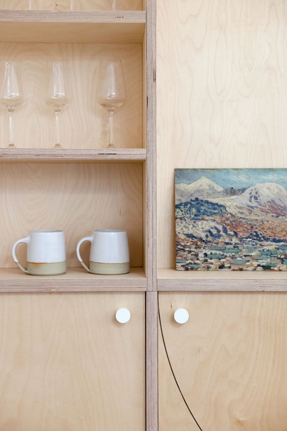 Curvy Plywood Punches Up the Interiors of a 1920s London Home Dwell