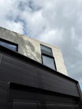 A Black Steel Stair Anchors the Addition of This Raw Concrete Home in Melbourne - Photo 13 of 15 - 