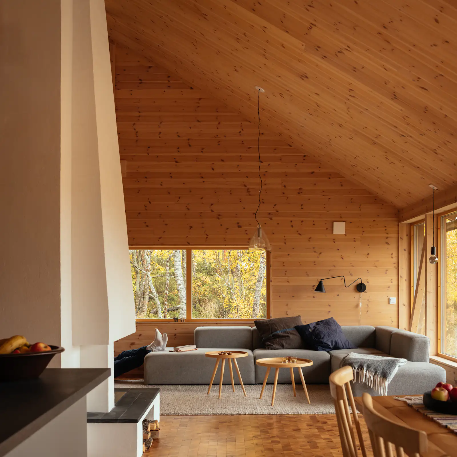 View of Photo 15 of 25 in A Central Fireplace Anchors This Uber-Cozy Cabin in a ...