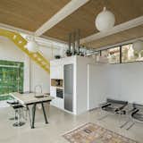 A Bright Yellow Steel Home in Barcelona Breaks With Its Brick Neighbors - Photo 7 of 14 -