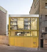 A Bright Yellow Steel Home in Barcelona Breaks With Its Brick Neighbors
