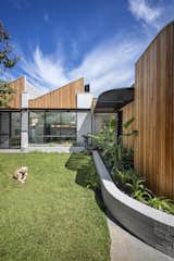 A Sawtooth Roofline Meets Deco-Inspired Curves at This Family Home in Australia - Photo 9 of 13 - 