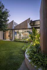 A Sawtooth Roofline Meets Deco-Inspired Curves at This Family Home in Australia - Photo 10 of 13 - 