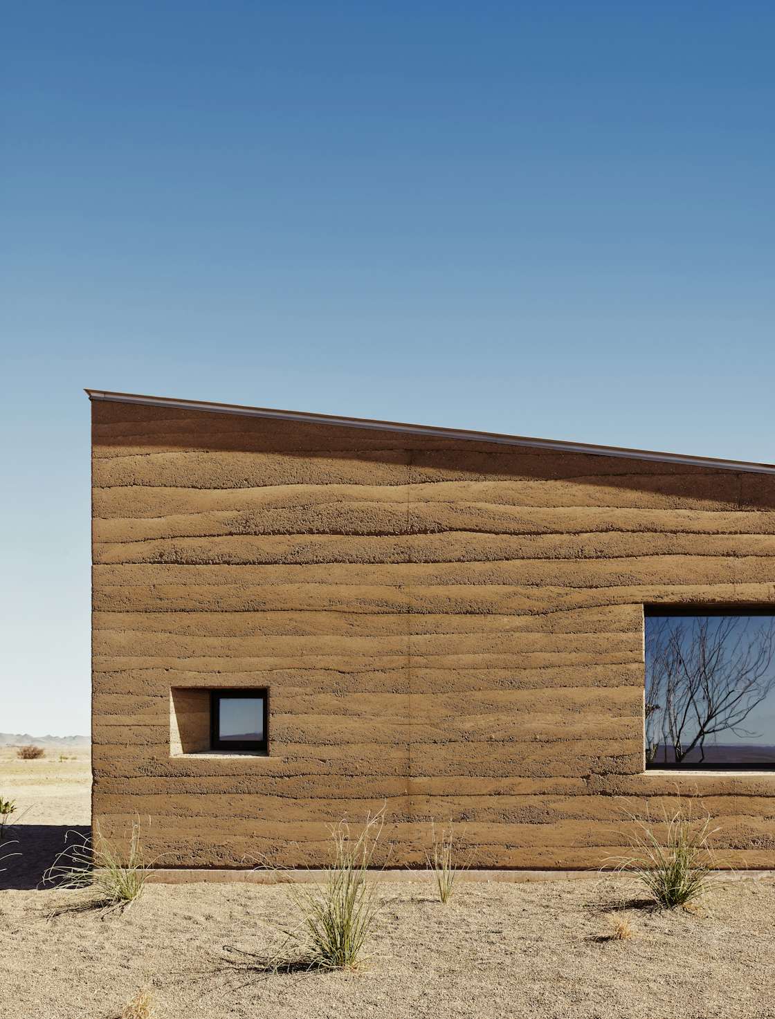 Photo 6 of 22 in Monolithic Rammed Earth Walls Keep This Marfa Ranch ...