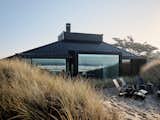 Fuse Architects took a 1960s-built home in Pajaro Dunes, California, and renovated it as a retreat for their clients, a family of five.  "The idea was to take the existing house and give it new life—one that met the needs and aesthetics of our designer clients," says the firm. "Although the shape and form of the remodeled home remains relatively unchanged from its original design, we wanted to take advantage of the ocean’s proximity by opening up the walls and providing framed views of the coast line."