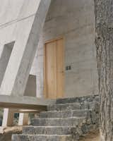 This Board-Formed Concrete “Cabin” Has the Longest Stovepipe We’ve Ever Seen - Photo 8 of 22 - 