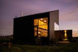 Lots of Windows and a Sunroom Suffuse This Black Chilean Cabin With Light - Photo 5 of 21 - 