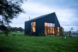 Lots of Windows and a Sunroom Suffuse This Black Chilean Cabin With Light - Photo 3 of 21 - 