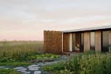 Gabion Walls Made of Volcanic Rock Flank a Flat-Roofed Farmhouse in Australia - Photo 7 of 28 - 