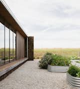 Gabion Walls Made of Volcanic Rock Flank a Flat-Roofed Farmhouse in Australia - Photo 12 of 28 - 