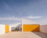 Sunny Yellow Doors at This Spanish Retreat Match the Flowers That Surround It